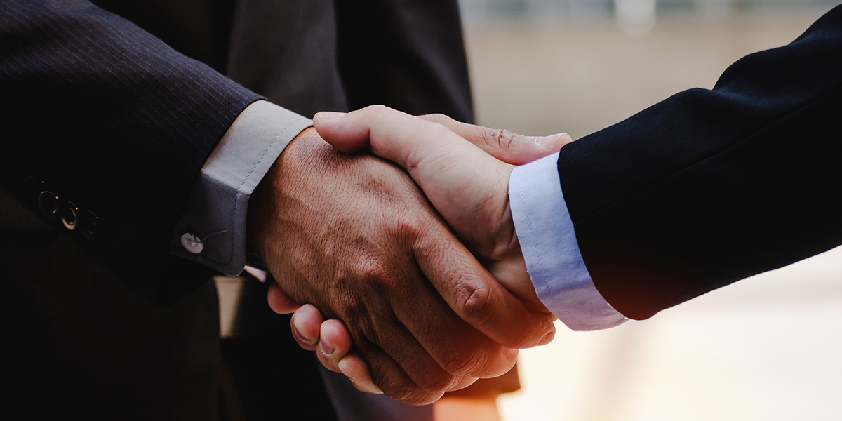 finalizing a business deal via handshake