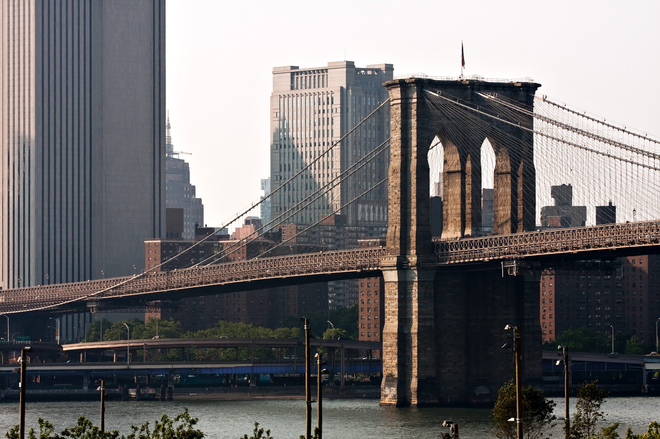 The Brooklyn Bridge And Manhattan New York City Skyline Near Dusk